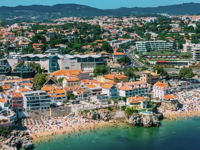 Framed Print : Aerial view of Cascais beaches and colourful rooftops of coastal town under bright sunlight with Sintra mountains in the background, Cascais, Portugal, Europe