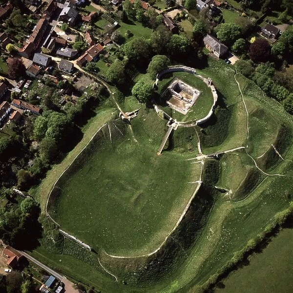 Aerial view of Castle Acre, remains of a motte and bailey castle with extensive earthworks