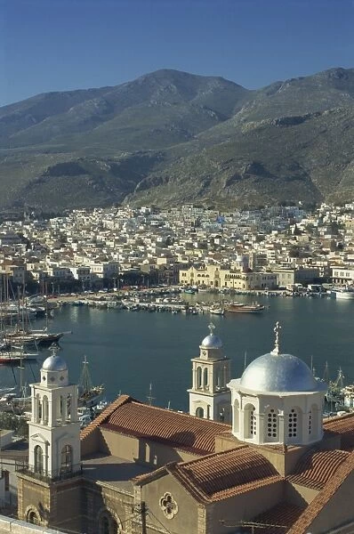 Aerial view over church, and beyond, the harbour and town of Kalimnos, Kalimnos Island