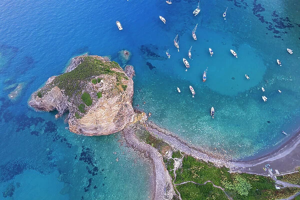 Aerial view of the cliff of Saint Silverio with boats anchored in Francese Bay, Palmarola island, Ponza municipality, Tyrrhenian Sea, Pontine archipelago, Latina Province, Latium (Lazio), Italy, Europe