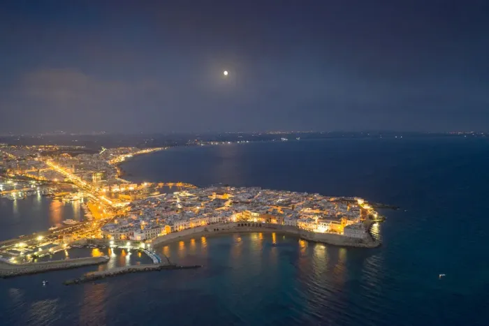 Framed Print : Aerial view of the coastal town of Gallipoli illuminated at night, Lecce province