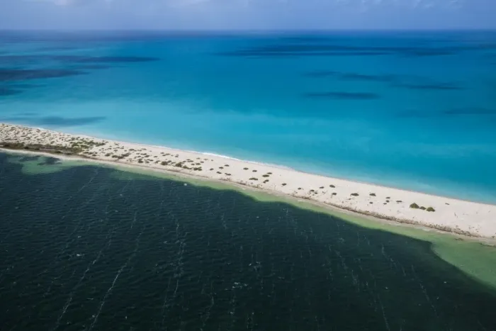 Framed Print : Aerial view of the color contrasts of Barbuda, tones change according to the current Framed Print : Aerial view of the color contrasts of Barbuda, tones change according to the current