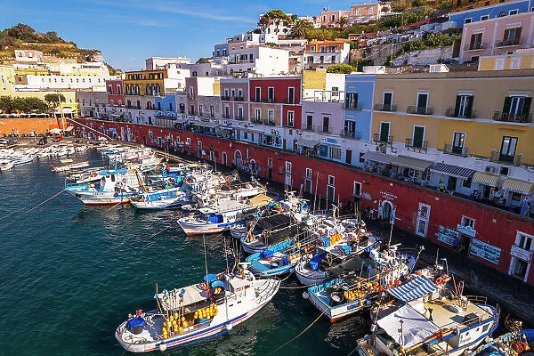 Aerial view of the colorful Italian village of Ponza with fishing vessels in the foreground, Pontine Islands, Latina province, Tyrrhenian Sea, Latium (Lazio), Italy, Europe