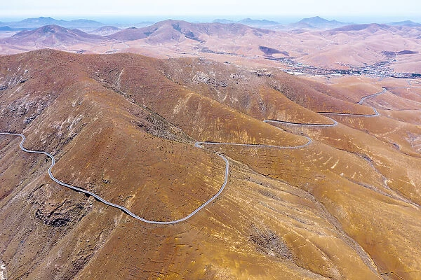 Aerial view of empty desert road, Mirador del Risco de las Penas viewpoint, Pajara