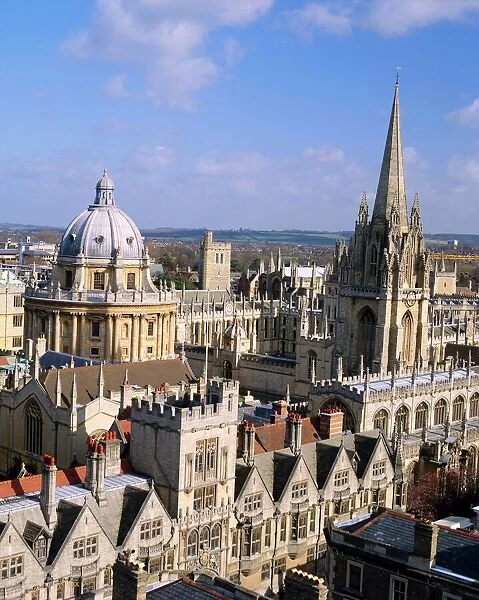 Aerial view over the dome of the Radcliffe Camera and a spire of an Oxford college
