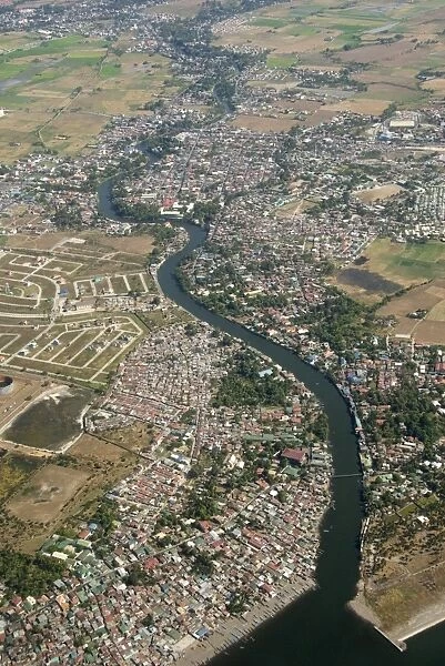 Aerial view of dormitory township on river into south end of Manila Bay