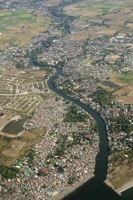 Framed Print : Aerial view of dormitory township on river into south end of Manila Bay Framed Print : Aerial view of dormitory township on river into south end of Manila Bay
