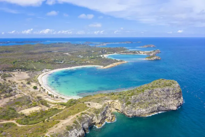 Framed Print : Aerial view by drone of cliffs surrounding Half Moon Bay washed by Caribbean Sea, Antigua Framed Print : Aerial view by drone of cliffs surrounding Half Moon Bay washed by Caribbean Sea, Antigua