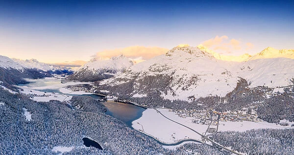 Aerial view by drone of Lej Da Champfer, Silvaplana, snowy Piz Da La Margna