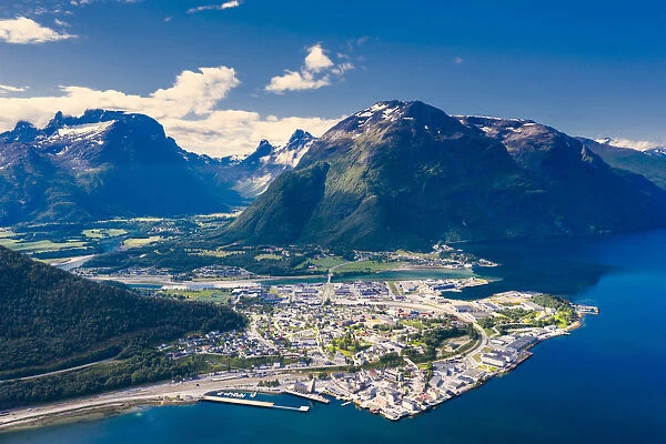 Aerial view by drone of mountains and fjord surrounding Andalsnes town, Rauma municipality