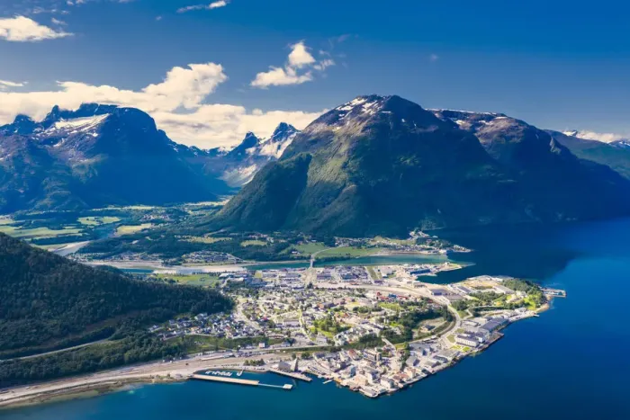 Framed Print : Aerial view by drone of mountains and fjord surrounding Andalsnes town, Rauma municipality Framed Print : Aerial view by drone of mountains and fjord surrounding Andalsnes town, Rauma municipality