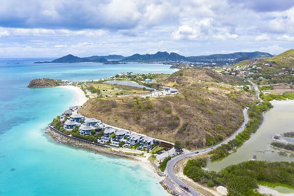 Aerial view by drone of Tamarind Hills luxury hotel ocean front and Ffryes Bay, Antigua