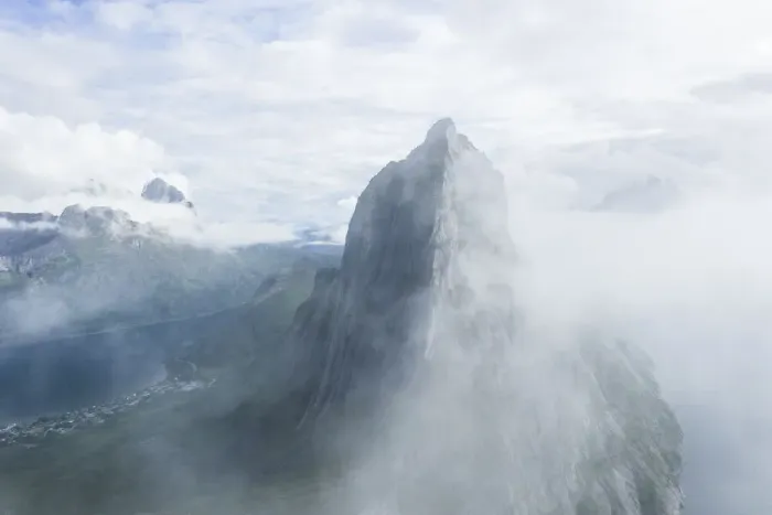 Framed Print : Aerial view of fog over the majestic Segla Mountain peak emerging from clouds Framed Print : Aerial view of fog over the majestic Segla Mountain peak emerging from clouds