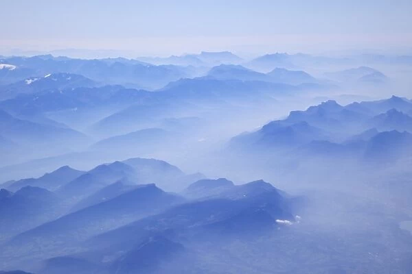 Aerial view of French Alps in early morning mist, France, Europe
