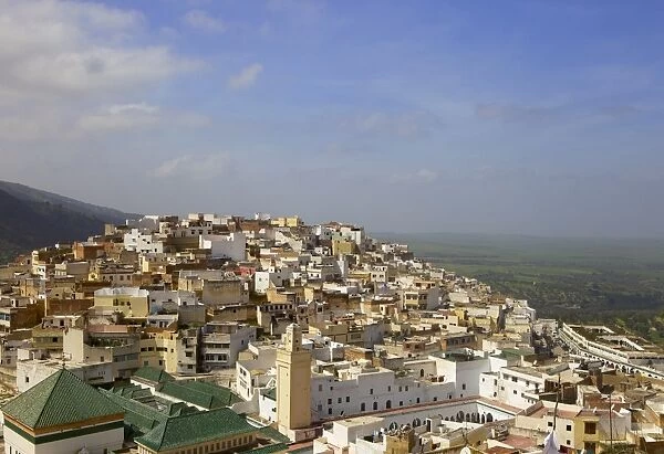 Aerial view of the green tiled roofs of the sacred city of Moulay Idriss, including the tomb and Zaouia of Moulay Idriss, Morocco, North Africa, Africa