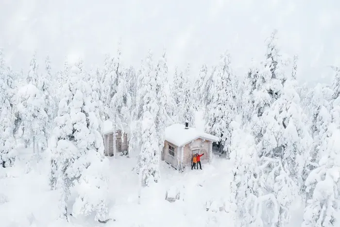 Framed Print : Aerial view of happy couple enjoying the winter holidays in a frozen hut in the snowy forest, Iso Syote, Northern Ostrobothnia, Lapland, Finland, Europe Framed Print : Aerial view of happy couple enjoying the winter holidays in a frozen hut in the snowy forest, Iso Syote, Northern Ostrobothnia, Lapland, Finland, Europe