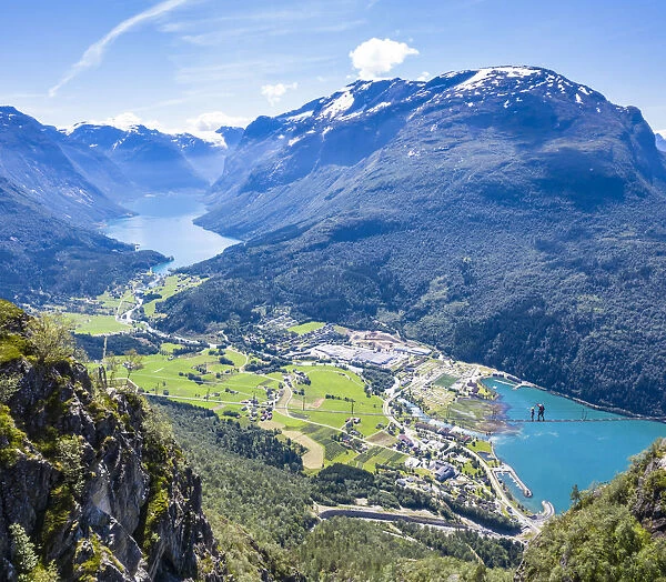 Aerial view of hikers on suspension bridge on Via Ferrata high up above the fjord