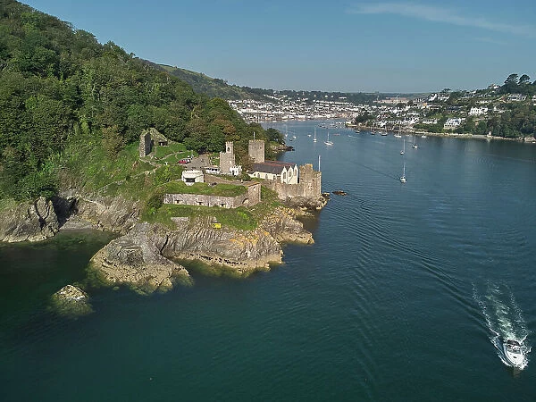 An aerial view of the historic 16th century Dartmouth Castle, in the mouth of the River Dart, with a view of Dartmouth in the background, on the south coast of Devon, England, United Kingdom, Europe