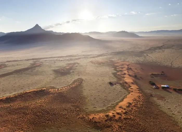 Framed Print : Aerial view from hot air balloon at dawn over magnificent desert landscape of sand dunes, mountains and Fairy Circles, Namib Rand game reserve Namib Naukluft Park, Namibia, Africa Framed Print : Aerial view from hot air balloon at dawn over magnificent desert landscape of sand dunes, mountains and Fairy Circles, Namib Rand game reserve Namib Naukluft Park, Namibia, Africa