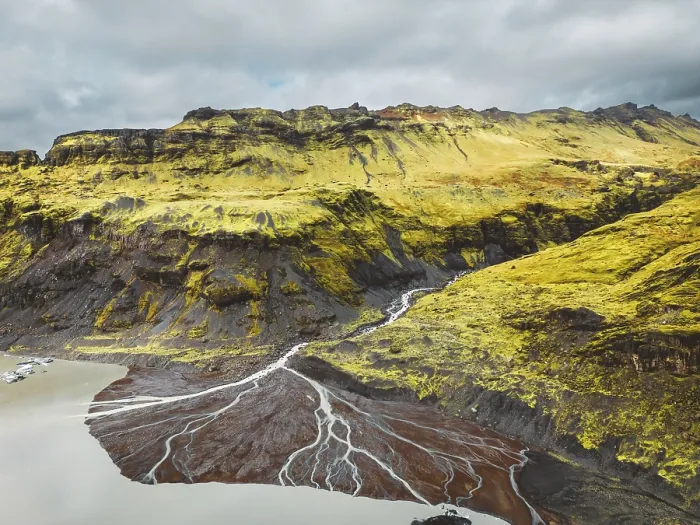 Framed Print : Aerial view of Icelandic riverbed flowing into the sea. River flowing through the volcanic landscape of Iceland