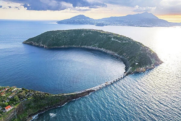 Aerial view of the island of Vivara, the ancient volcano crater collapsed, with Ischia island's mountains in the background, Tyrrhenian Sea, Naples district, Naples Bay, Campania region, Italy, Europe