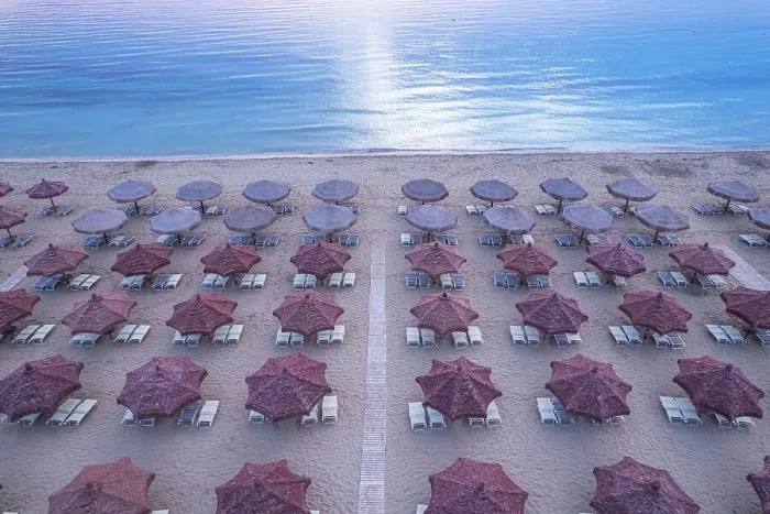 Framed Print : Aerial view of large group of tidy beach umbrellas facing the Mediterranean Sea, Italy, Europe Framed Print : Aerial view of large group of tidy beach umbrellas facing the Mediterranean Sea, Italy, Europe