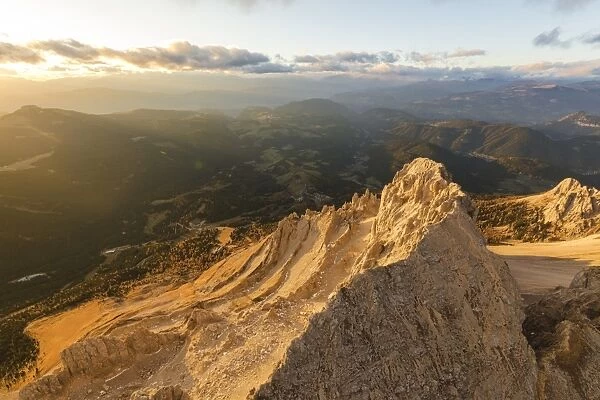 Aerial view of Latemar massif and Obereggen at sunset, Dolomites, South Tyrol, Italy