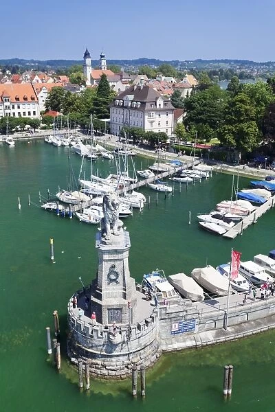 Aerial view from the lighthouse across the port and the old town with the sculpture of the Bavarian Lion, Lindau, Lake Constance (Bodensee), Bavaria, Germany, Europe
