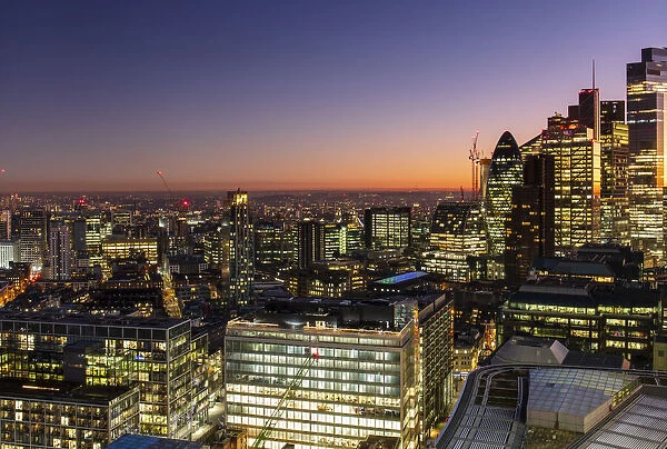 Aerial view of London skyline at sunset, including City of London skyscrapers, London, England, United Kingdom, Europe