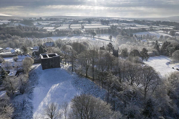 Aerial view of Lydford Castle on a snowy winter morning, Lydford, Devon, England