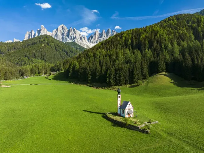 Framed Print : Aerial view of the Odle and iconic chapel of St. John in Ranui in spring, St. Magdalena, Funes Valley, Dolomites, South Tyrol, Italy, Europe