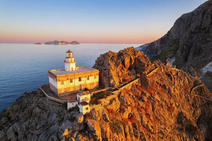 Framed Print : Aerial view of Punta della Guardia lighthouse on top of a cliff on the island of Ponza, lit from sunrise, Ponza island, Pontine islands, Mediterranean Sea, Latium, Lazio, Italy, Europe Framed Print : Aerial view of Punta della Guardia lighthouse on top of a cliff on the island of Ponza, lit from sunrise, Ponza island, Pontine islands, Mediterranean Sea, Latium, Lazio, Italy, Europe