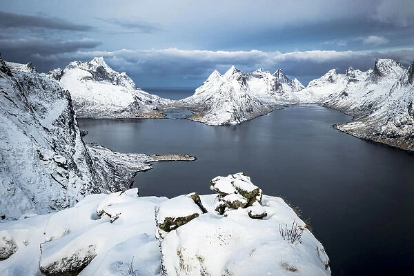 Aerial view of Reine Bay and mountains covered with snow in winter, Nordland, Lofoten Islands, Norway, Scandinavia, Europe