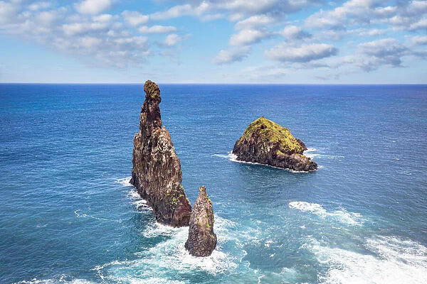Aerial view of rock formation Ilheus da Rib and Ribeira da Janela in the rough ocean