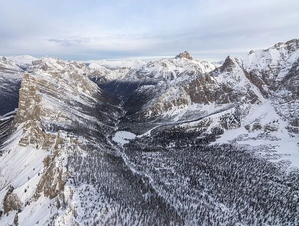 Aerial view of rocky peaks of Val Padeon and snowy woods, Cortina d Ampezzo, Province of Belluno
