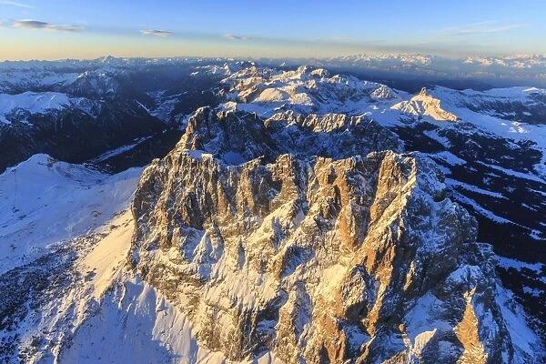 Aerial view of Sassolungo Sassopiatto and Grohmann peaks at sunset, Sella Group, Dolomites