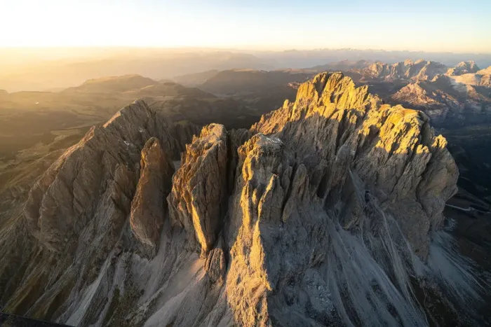 Framed Print : Aerial view of Sassolungo and Sassopiatto lit by the warm autumn sunset, Val Gardena Framed Print : Aerial view of Sassolungo and Sassopiatto lit by the warm autumn sunset, Val Gardena