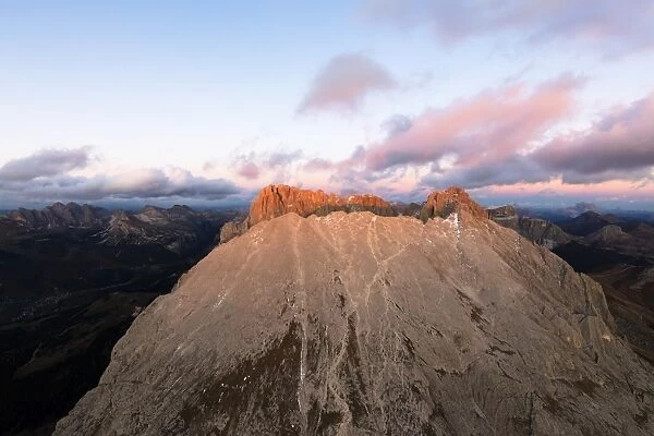Aerial view of Sassolungo and Sassopiatto mountain range at sunset, Dolomites, South Tyrol