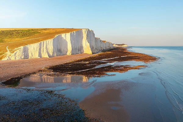 Aerial view of Seven Sisters chalk cliffs at sunset, South Downs National Park, East Sussex, England, United Kingdom, Europe