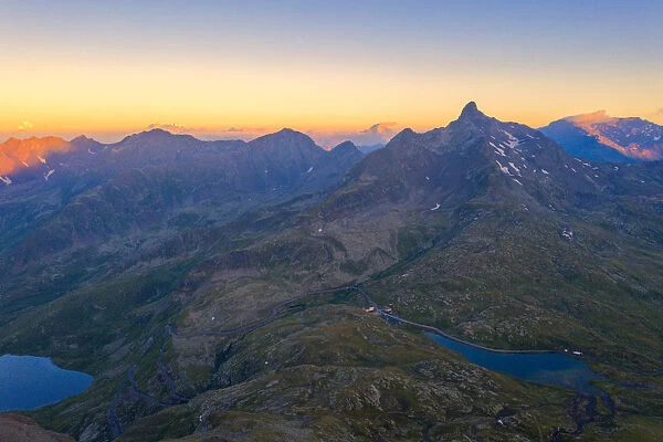 Aerial view of the sky at sunrise over the rocky peaks at Gavia Pass, Valfurva, Valtellina