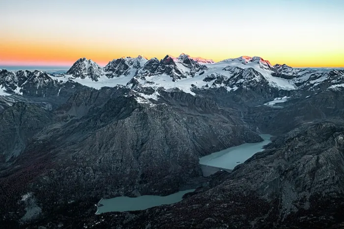 Framed Print : Aerial view of the snowy Bernina Range, Campo Moro dam and reservoir at sunrise in autumn, Valmalenco, Lombardy, Italy Framed Print : Aerial view of the snowy Bernina Range, Campo Moro dam and reservoir at sunrise in autumn, Valmalenco, Lombardy, Italy