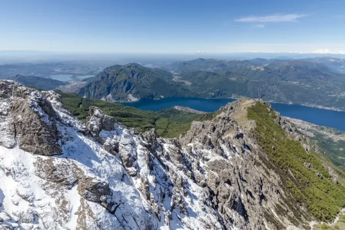 Framed Print : Aerial view of the snowy ridges of the Grignetta mountain with Lake Como in the background Framed Print : Aerial view of the snowy ridges of the Grignetta mountain with Lake Como in the background