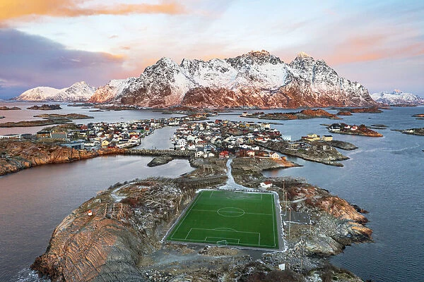 Aerial view of soccer stadium and Henningsvaer village during winter dawn, Nordland county, Lofoten Islands, Norway, Scandinavia, Europe