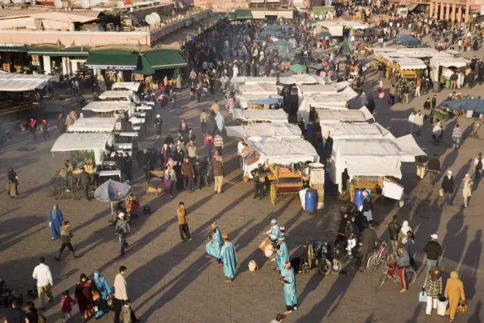 Framed Print : Aerial view of stalls, people and entertainers in busy Djemma el Fna square in the Medina Framed Print : Aerial view of stalls, people and entertainers in busy Djemma el Fna square in the Medina