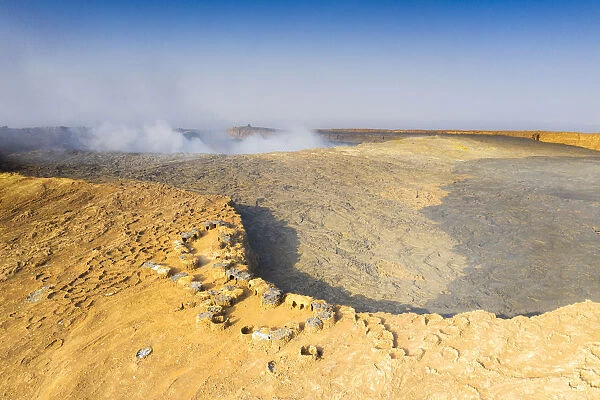 Aerial view of stone huts on top of majestic Erta Ale volcano, Danakil Depression