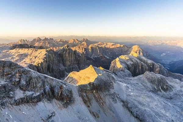 Aerial view of sunset over Sella Group and Odle mountain range in autumn, Val Gardena