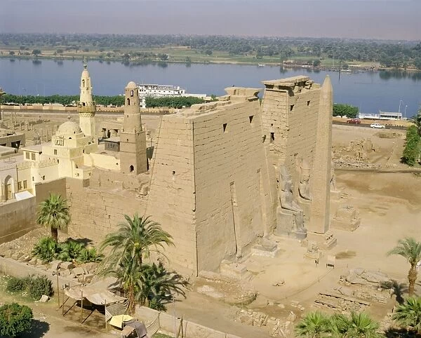 Aerial view over the Temple of Luxor and the Abu el-Haggag Mosque, an Islamic building inside an ancient Egyptian temple beside the River Nile, Luxor, Thebes, Egypt, North