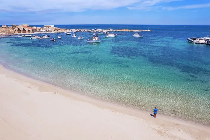 Framed Print : Aerial view of tourist standing in an empty white sand beach looking at the sea in front of the fishing village of Marzamemi, Marzamemi, Pachino municipality, Siracusa province, Sicily, Italy, Mediterranean, Europe Framed Print : Aerial view of tourist standing in an empty white sand beach looking at the sea in front of the fishing village of Marzamemi, Marzamemi, Pachino municipality, Siracusa province, Sicily, Italy, Mediterranean, Europe