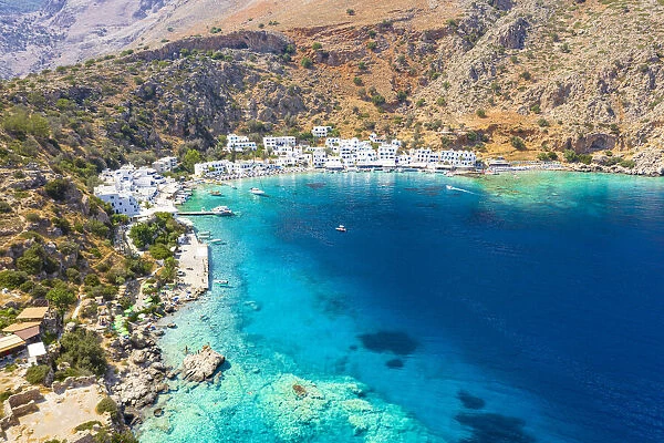Aerial view of traditional whitewashed buildings of Loutro village and transparent sea, Crete island, Greek Islands, Greece, Europe