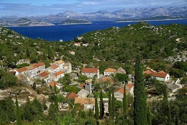 Aerial view over village of Korita, and hills to the coast on Mljet Island
